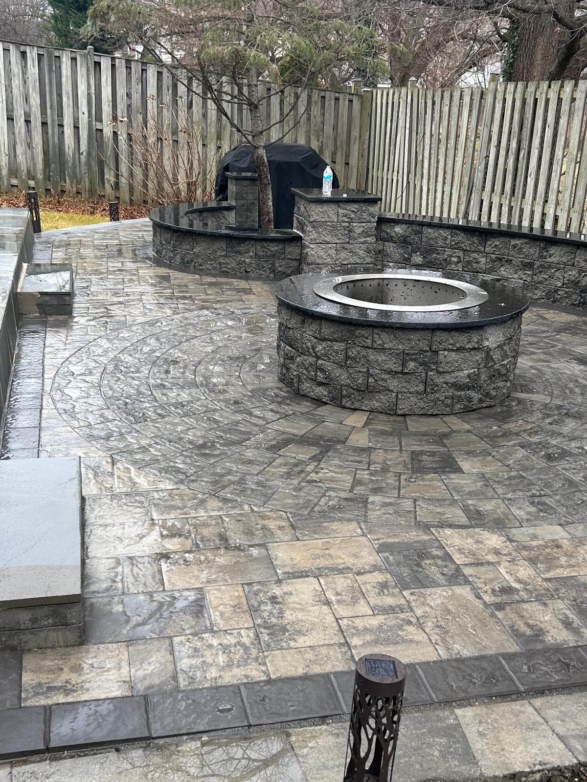 Paver patio with fire pit and circle pattern detail