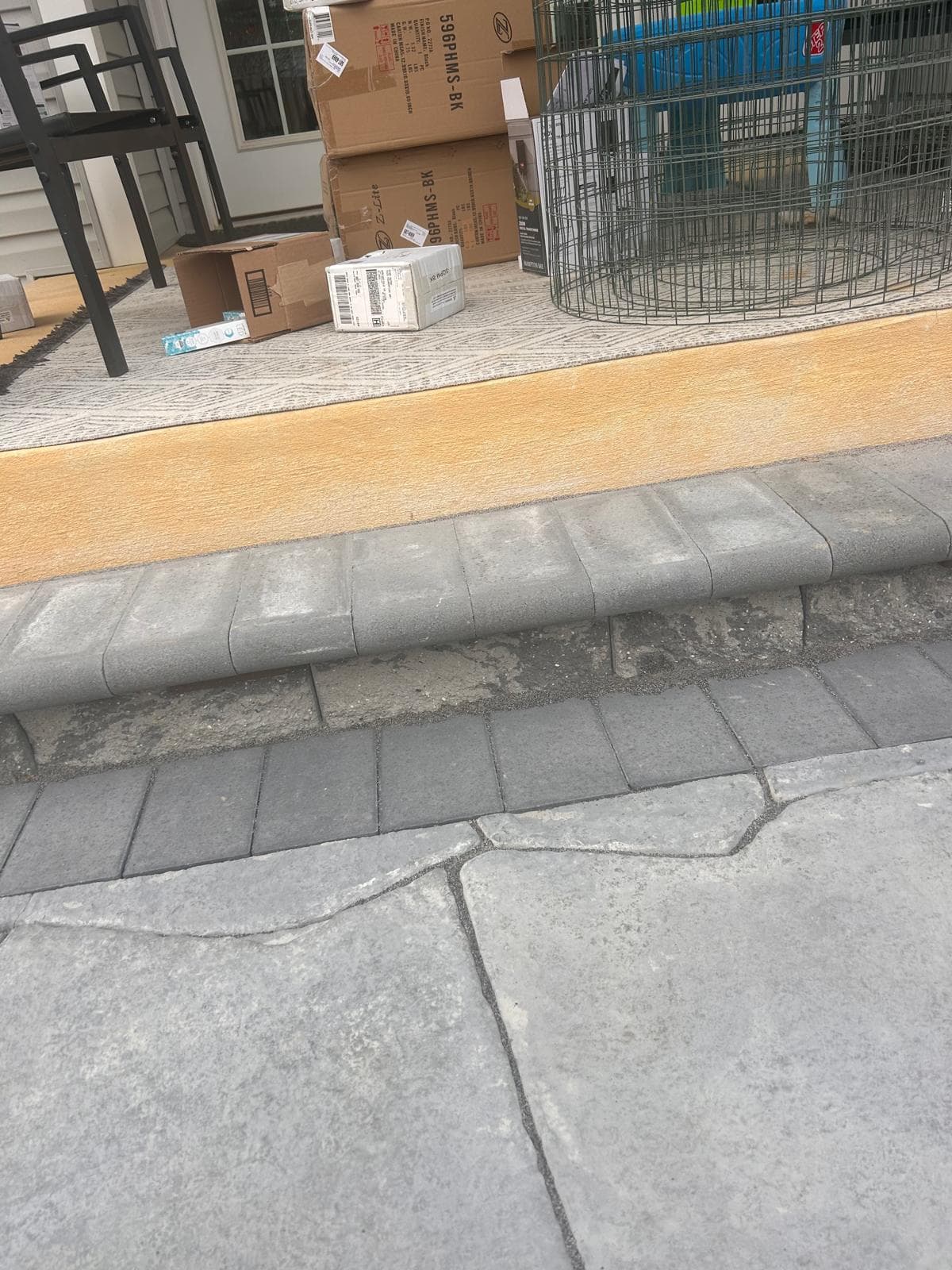 Stone walkway curving through landscaped front yard